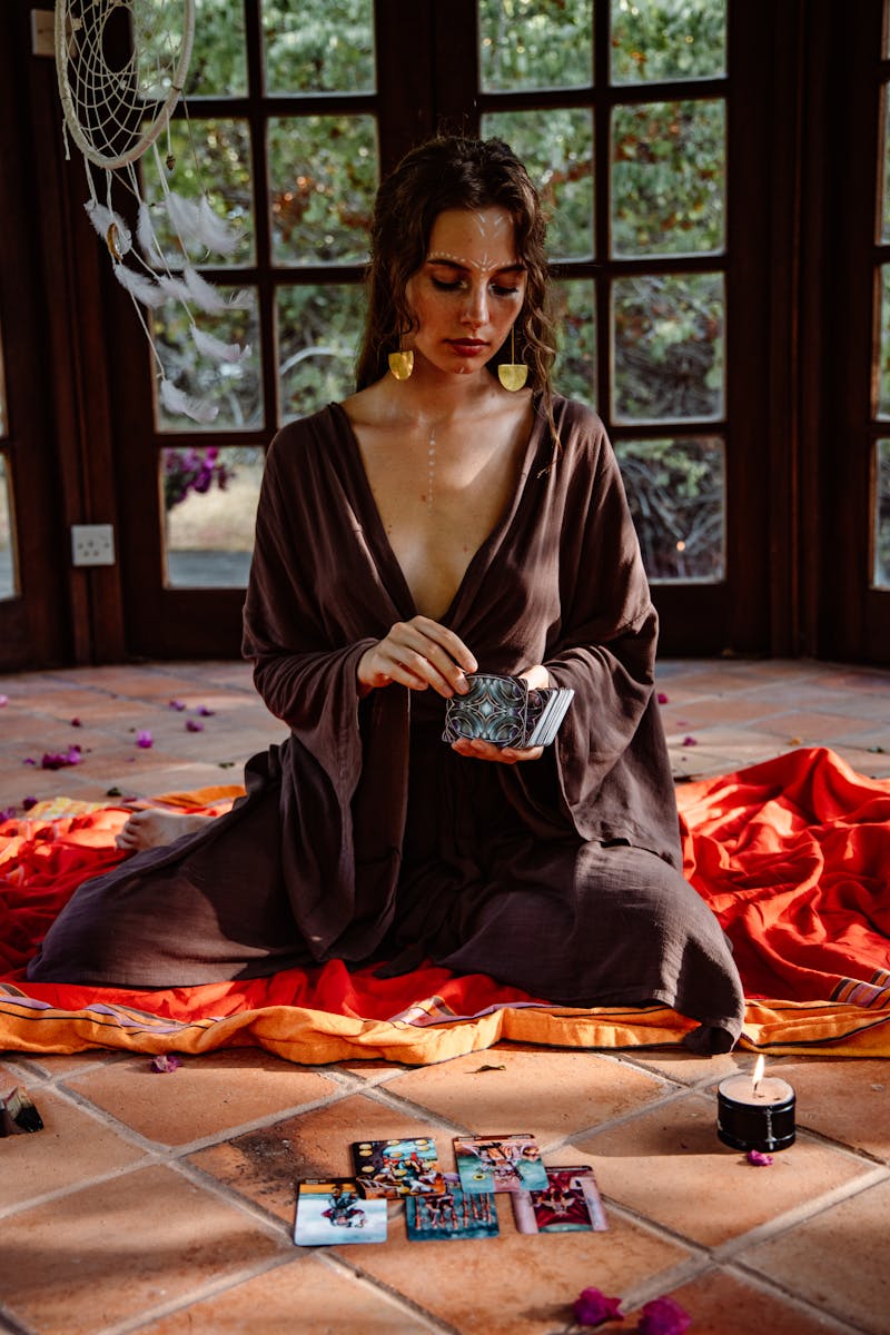 A Woman Holding a Deck of Tarot Cards